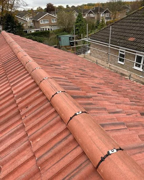 Completed roof ridge with red tiles