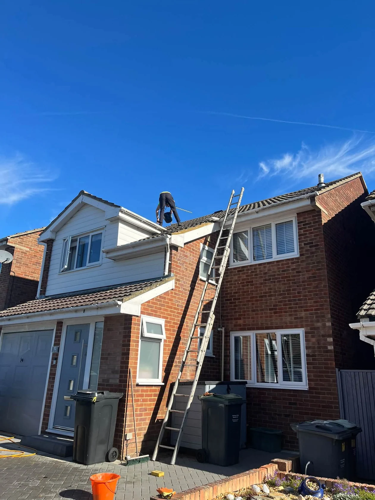 Roofer working on residential property